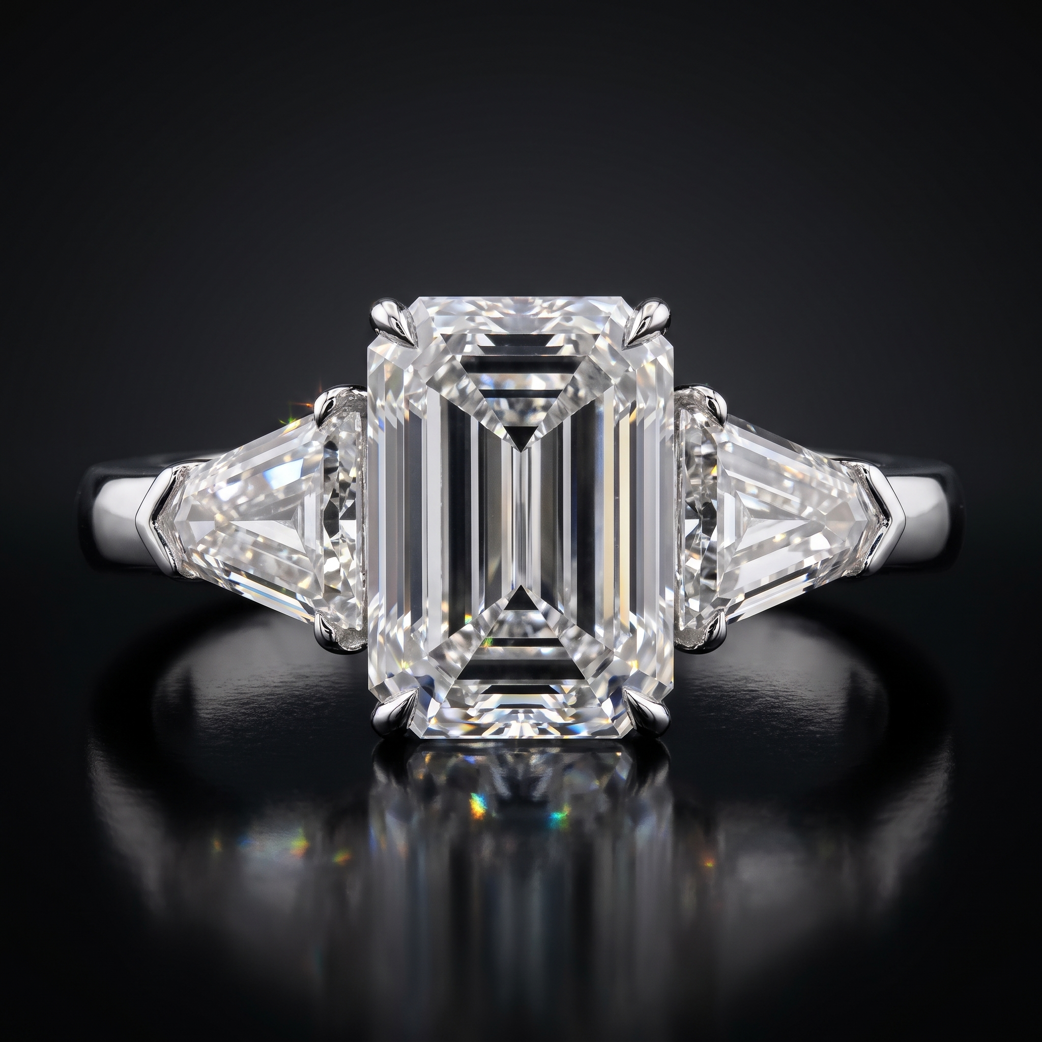 5ct emerald cut lab diamond ring with tapered shields, detail on black