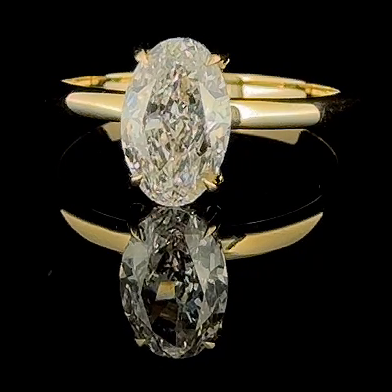 3ct oval hidden halo lab grown diamond engagement ring, 14k yellow gold, real studio front view on black