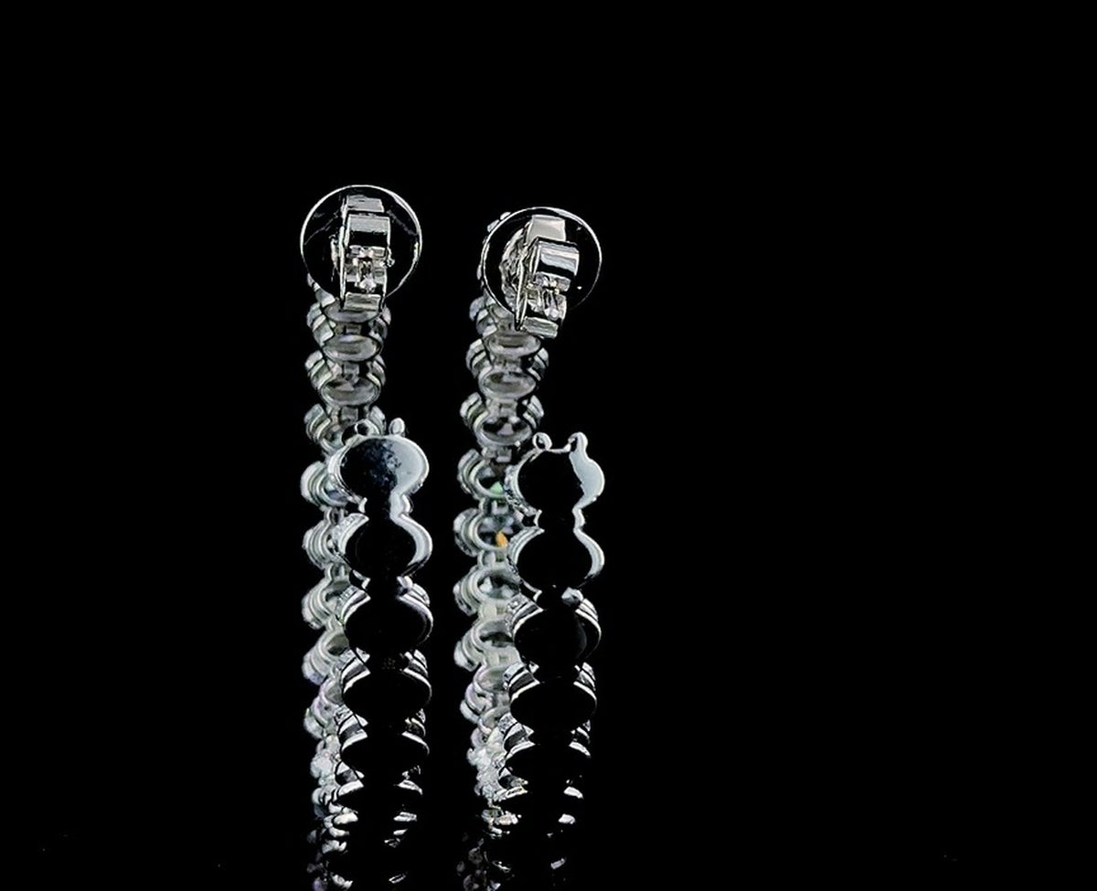 oval inside out lab diamond hoops, angled studio view