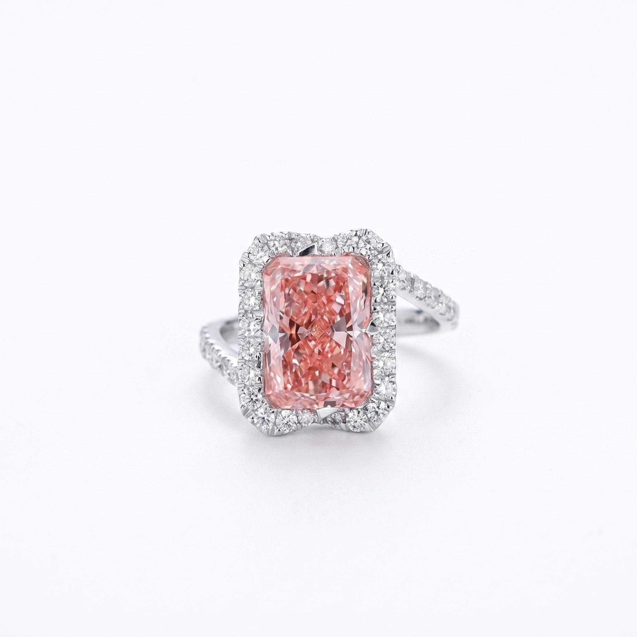 5ct fancy pink radiant lab grown diamond bypass ring with halo, white background